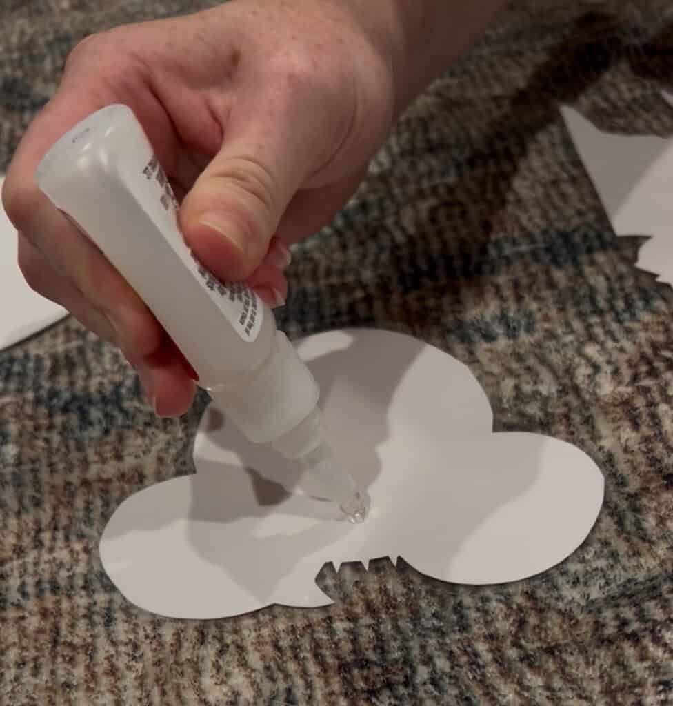 glueing magnets onto the back of disney cruise door magnets