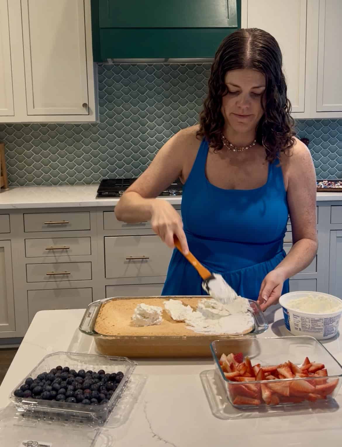 frosting a cake with cool whip