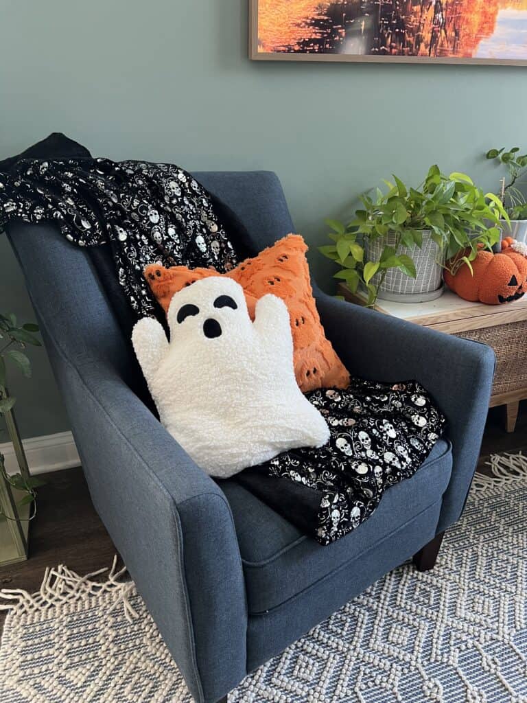 halloween pillows on a chair