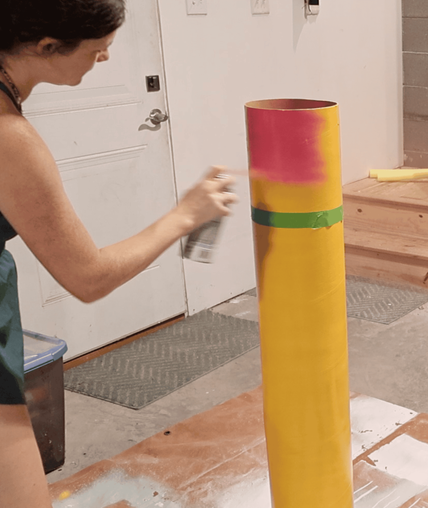 spray painting a cardboard tube