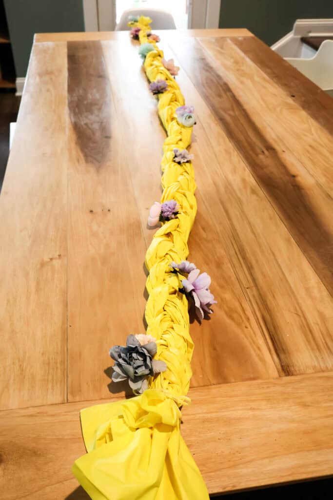 adding flowers to rapunzel centerpiece