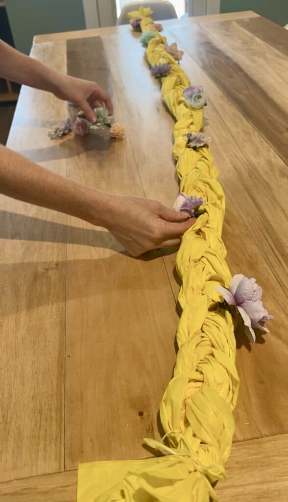adding flowers to rapunzel centerpiece