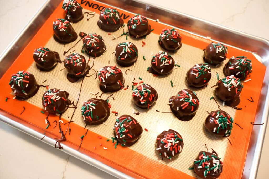 cookie dough bon bons with christmas sprinkles