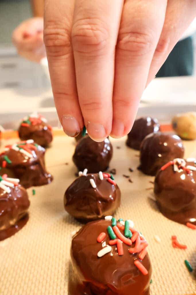adding sprinkles to cookie dough truffles