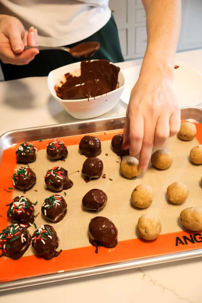 dipping cookie dough balls in chocolate