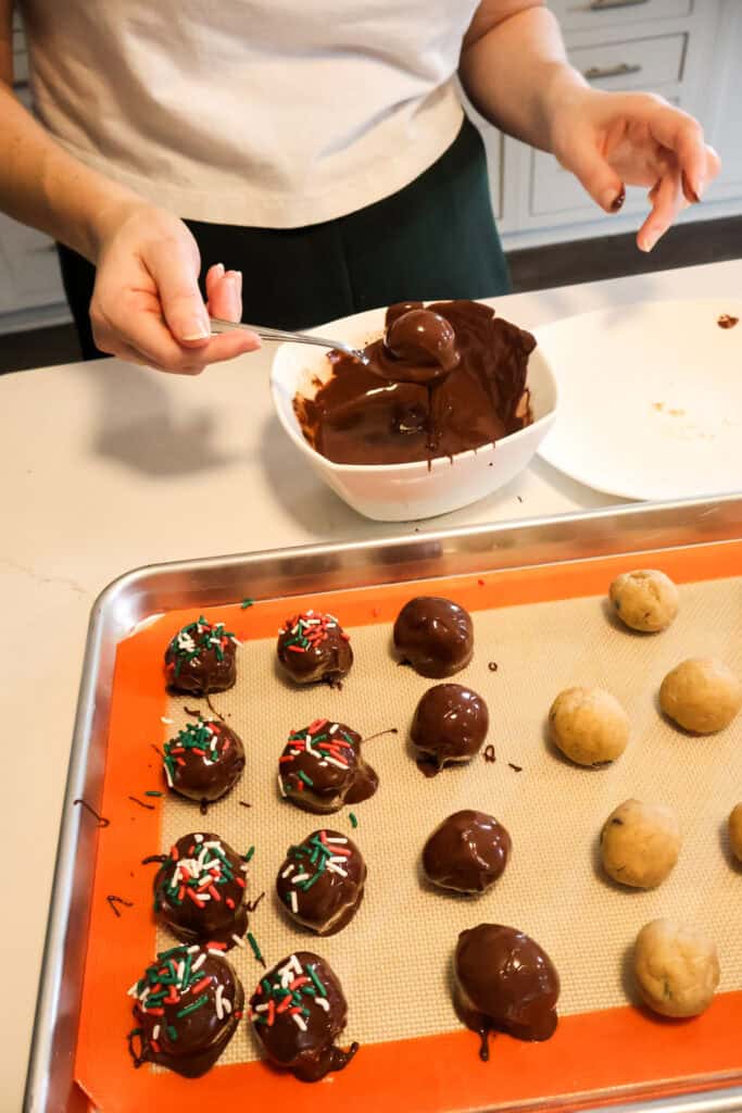 dipping cookie dough balls in chocolate