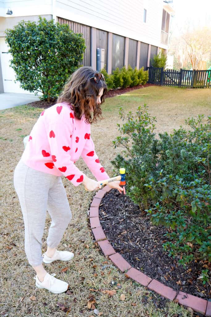 mounting pool noodle hearts in the yard
