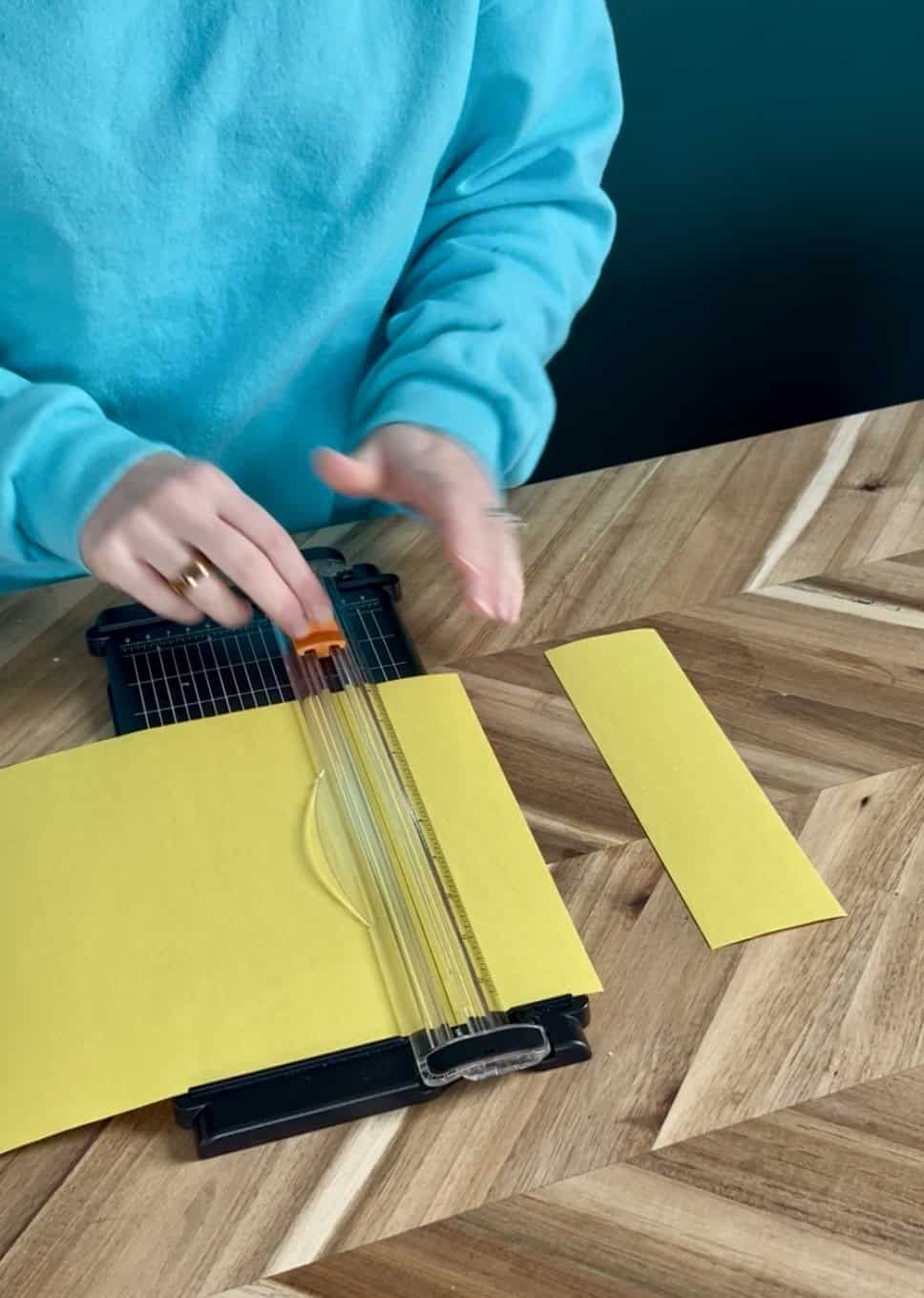 cutting yellow paper strips