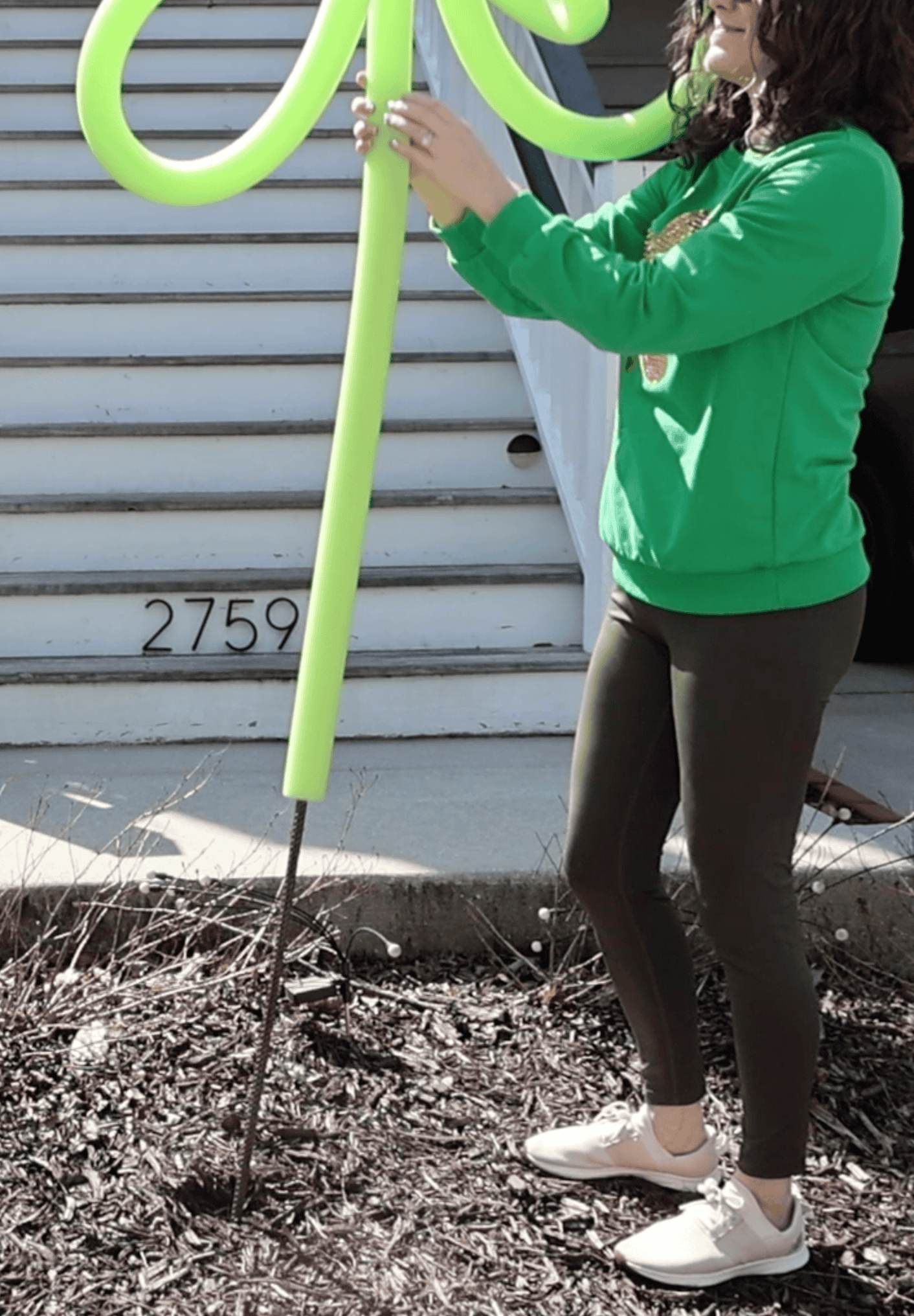 hammering rebar into the yard