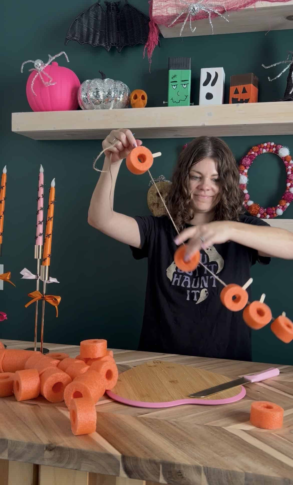 stringing up pool noodle pumpkins