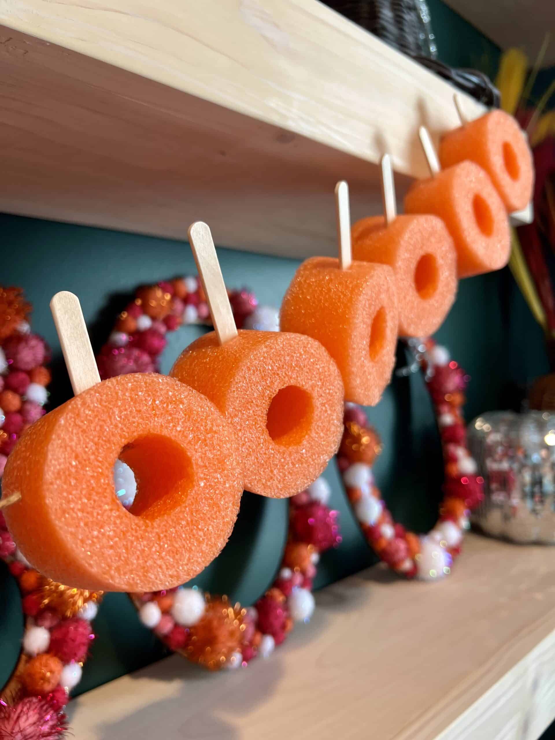 DIY pool noodle pumpkin garland
